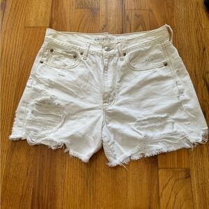 White ripped shorts